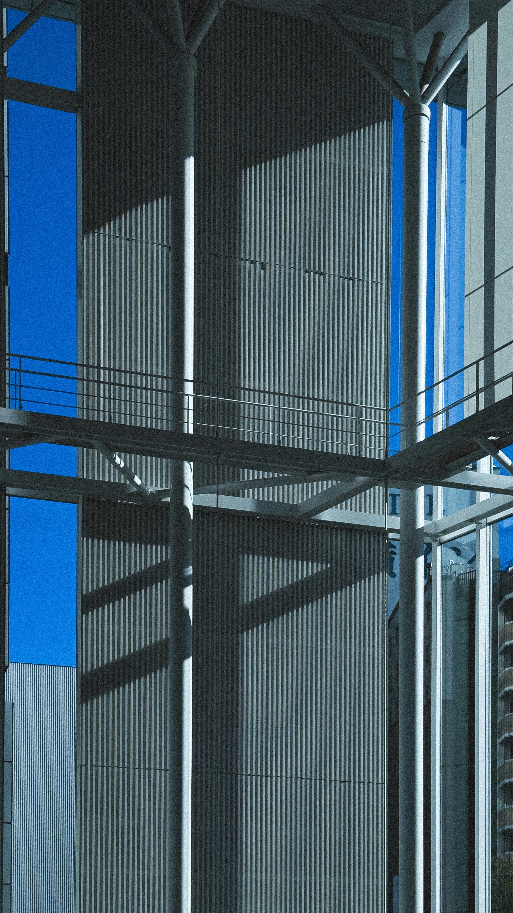 Modern building with corrugated metal and blue sky