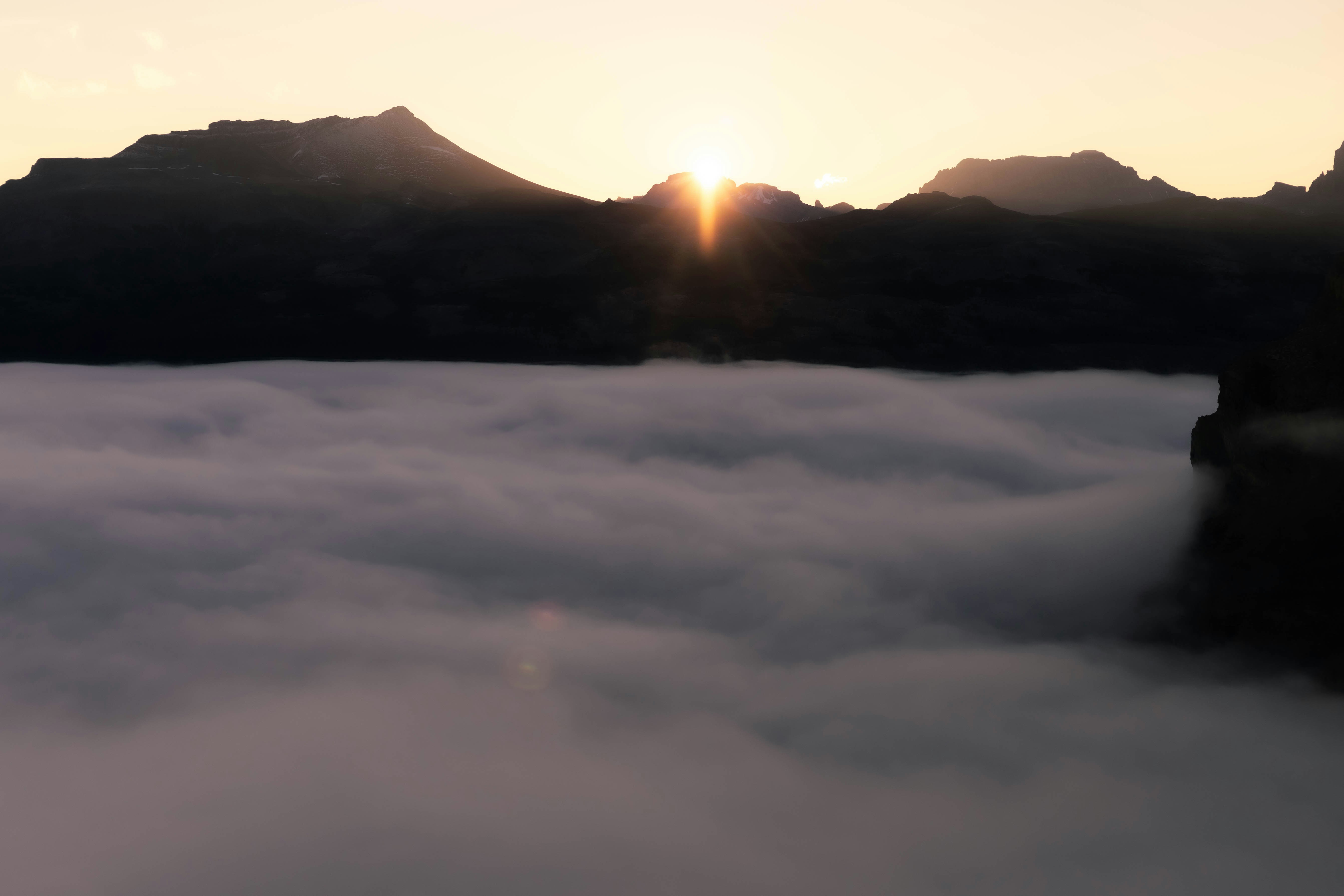 Sunrise over a sea of clouds in mountains