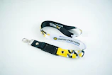 Two lanyards with united tractors logo on white background