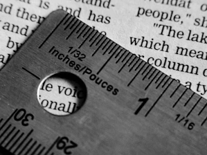 A ruler measuring text on a page.