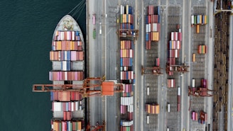 Cargo ship loaded with colorful containers at a busy port.