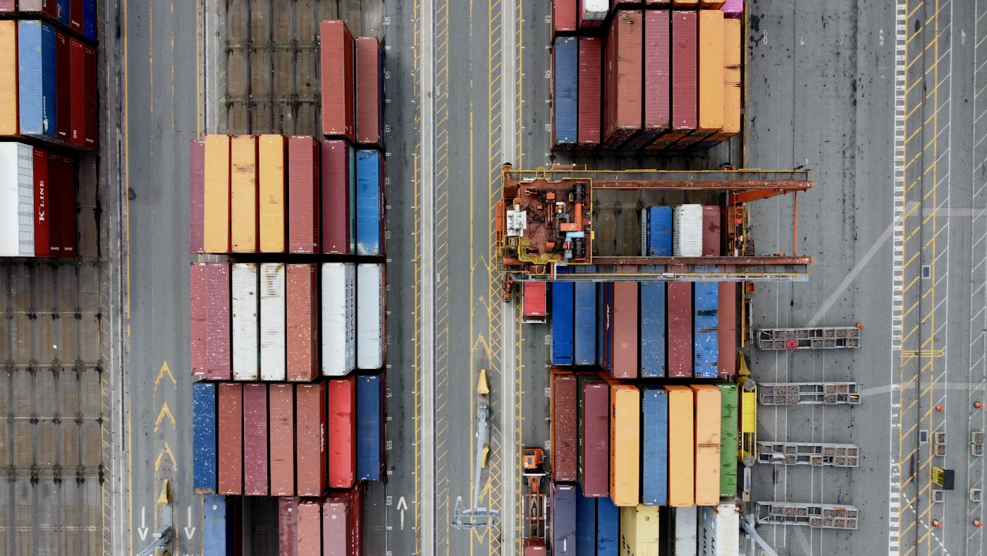 Aerial view of stacked shipping containers at a port