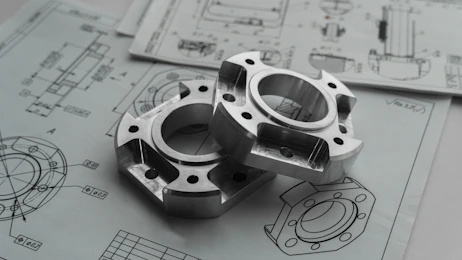 Metal mechanical seal components on engineering blueprints