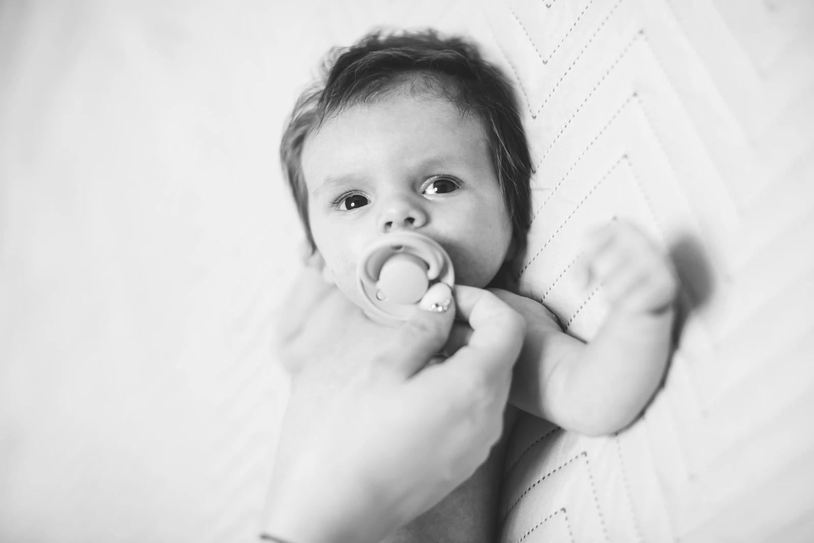 Baby resting with a pacifier
