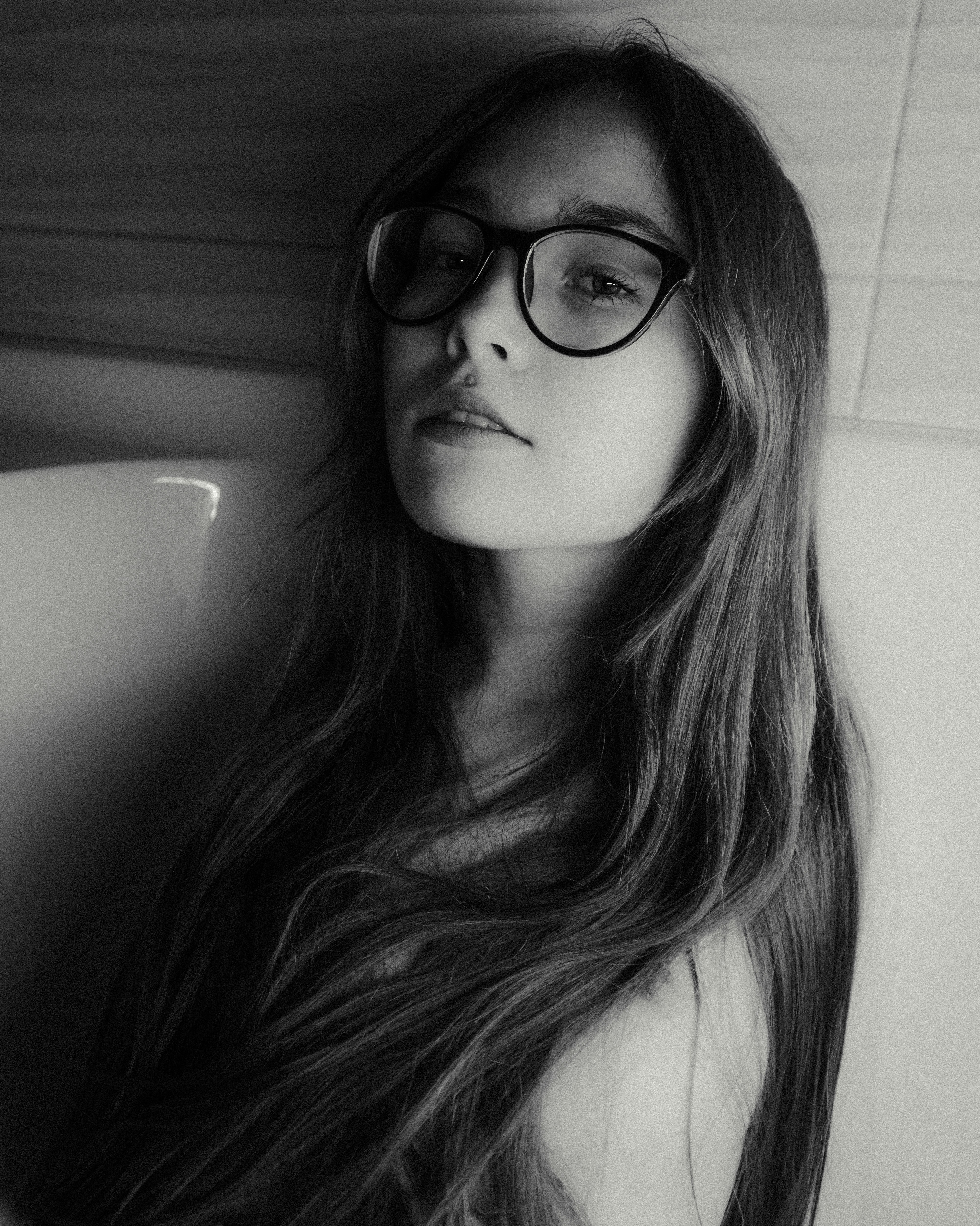 Young woman with glasses and long hair