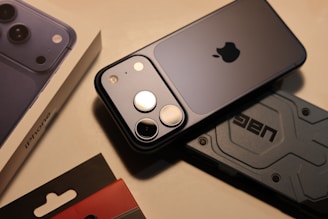 A dark smartphone with a camera lens array.