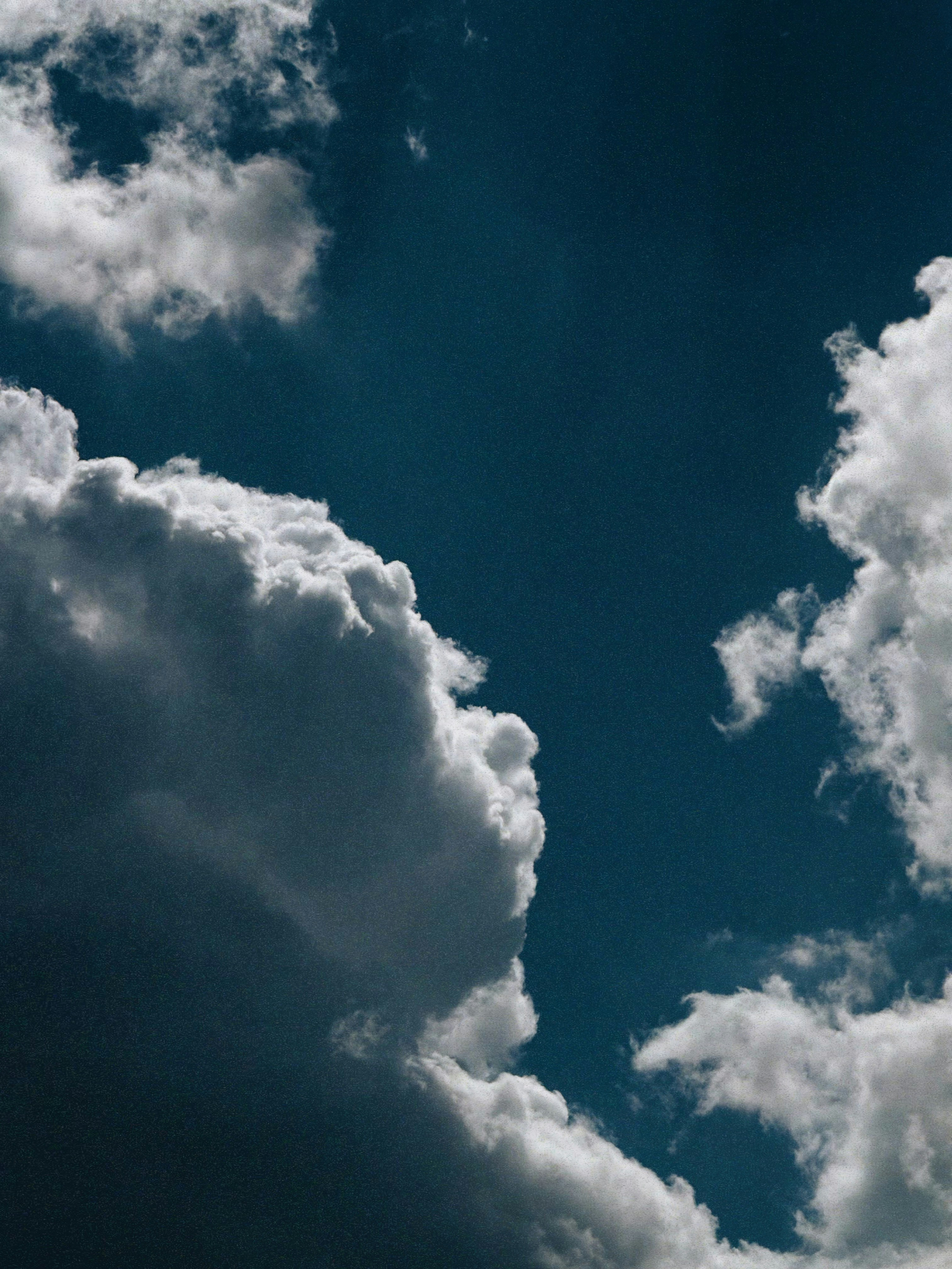 Dramatic clouds against a deep blue sky