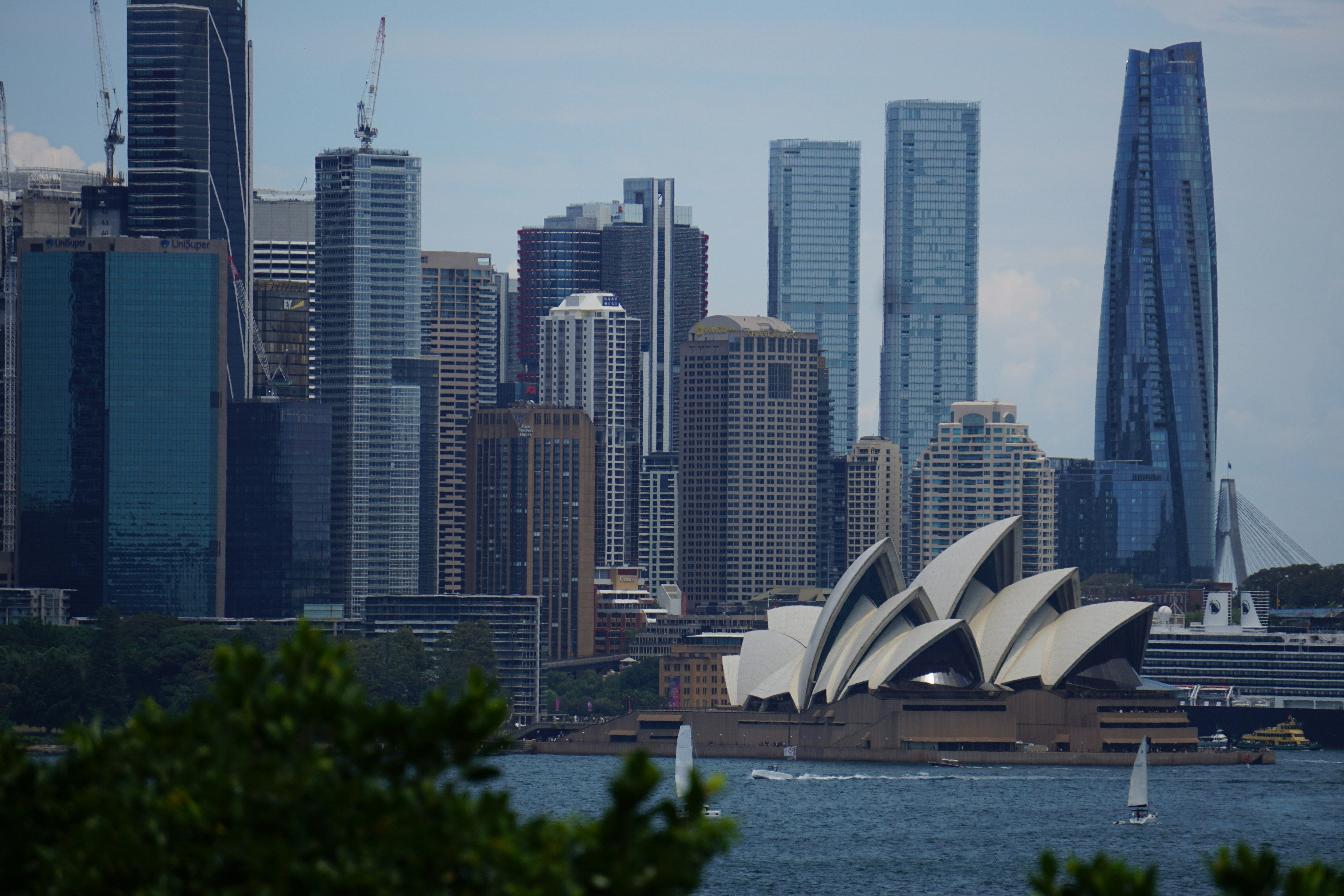 Sydney Opera House with Sydney skyline across the harbor