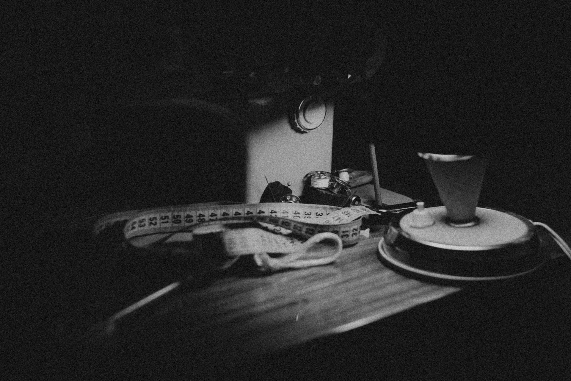 Sewing machine with measuring tape and iron