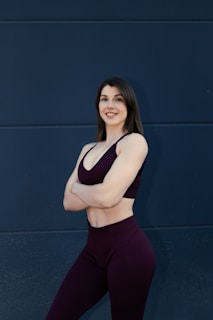 Fit woman in athletic wear with arms crossed