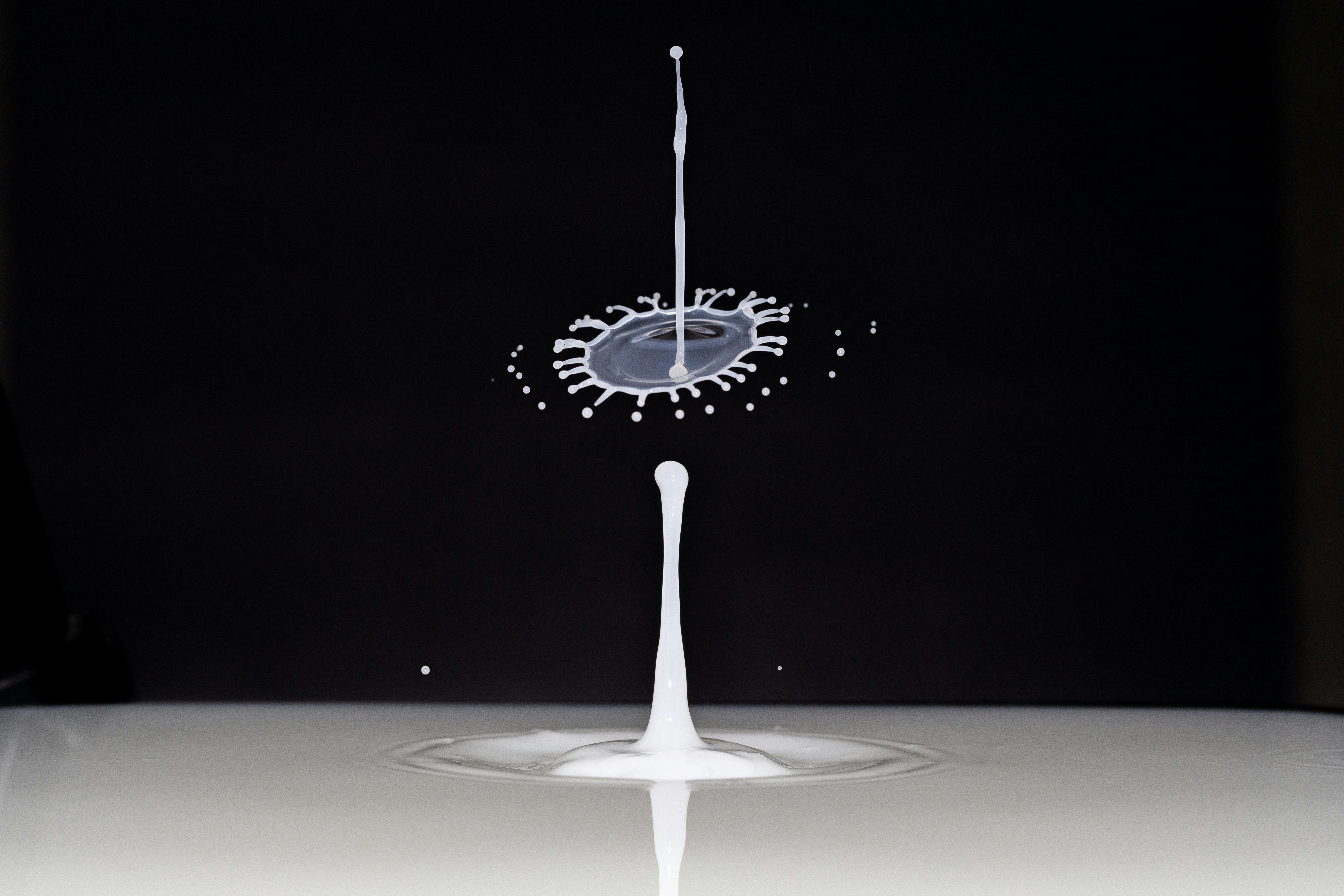 Two streams of liquid colliding and splashing