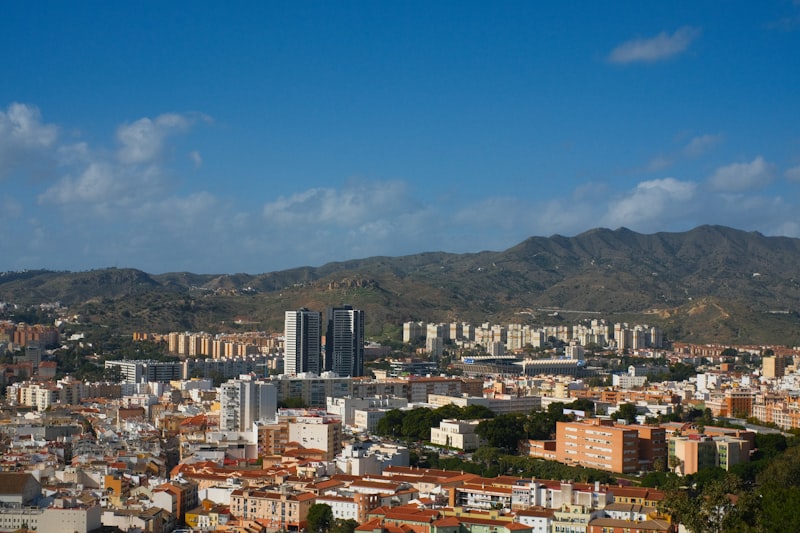 City buildings with mountains
