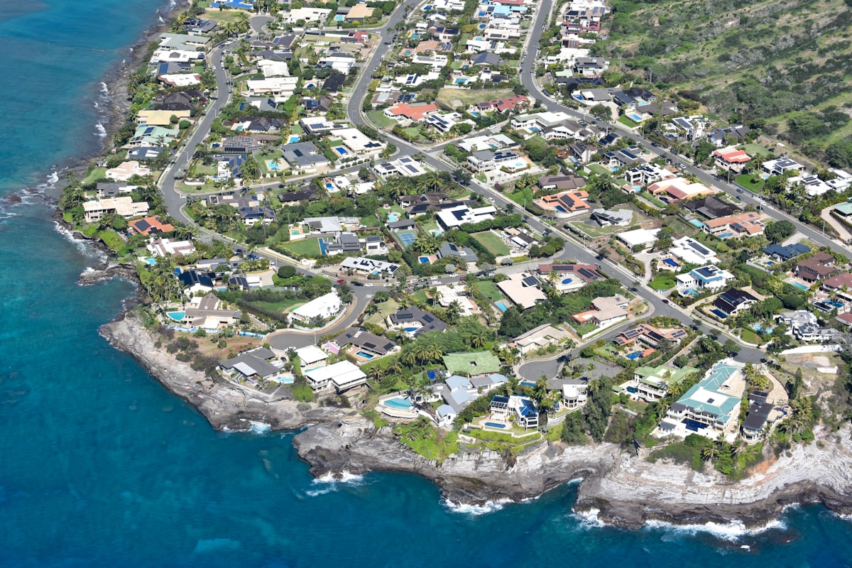 Aerial view of Oahu residential neighborhood with ocean