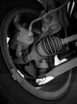 Close-up of brake pads and rotor assembly on car