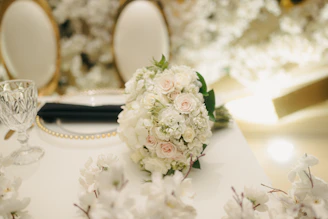 A white floral arrangement on a table