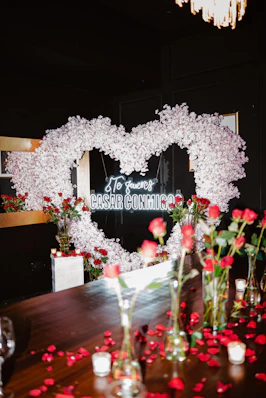 Heart-shaped floral arrangement with proposal message and roses