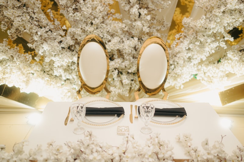 Elegant wedding table setting with white floral decor