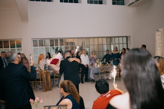 Couple dancing at a wedding reception with sparklers