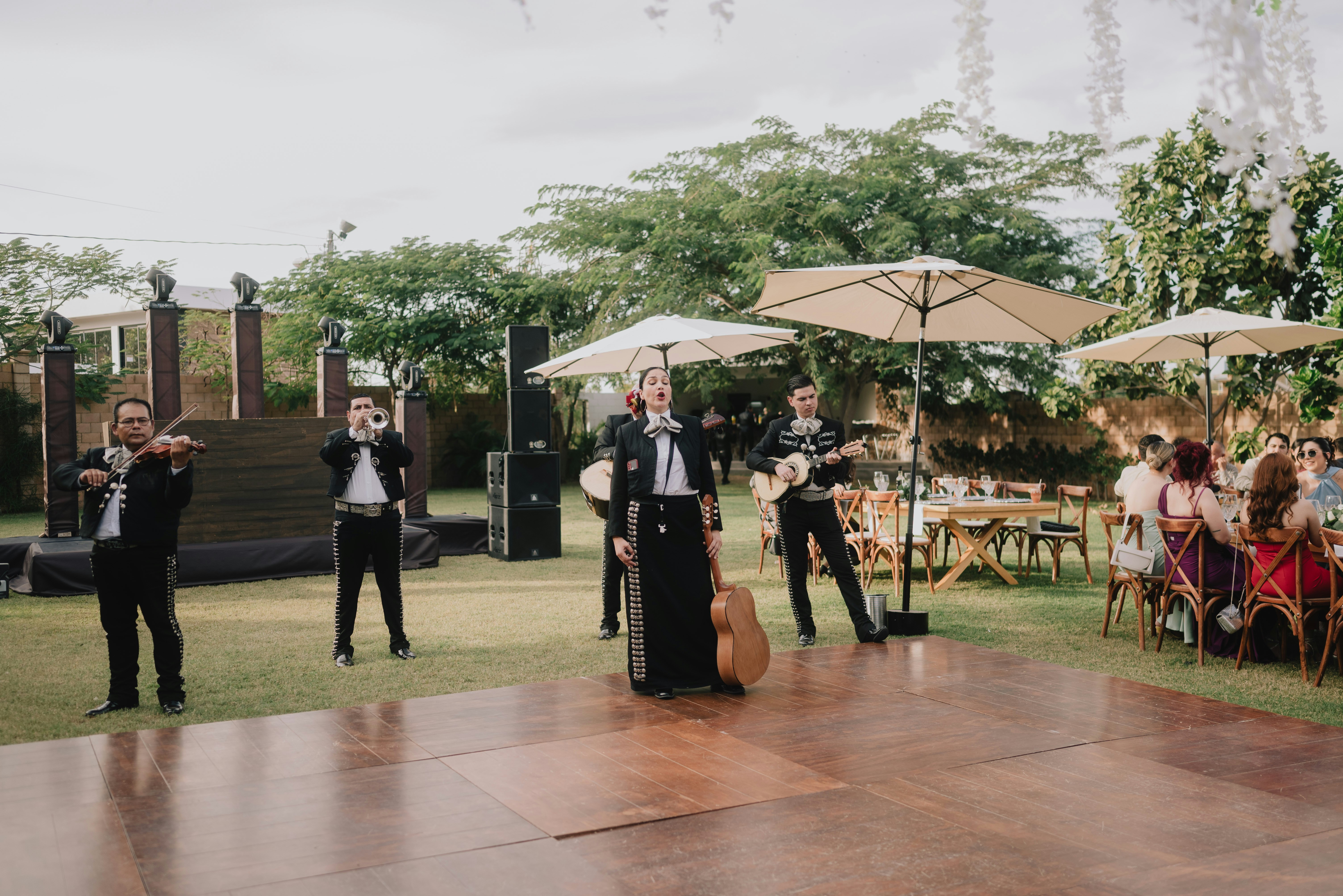 Mariachi band performing outdoors at an event