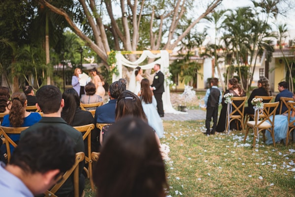 Floral designer arranging a centerpiece during a consultation