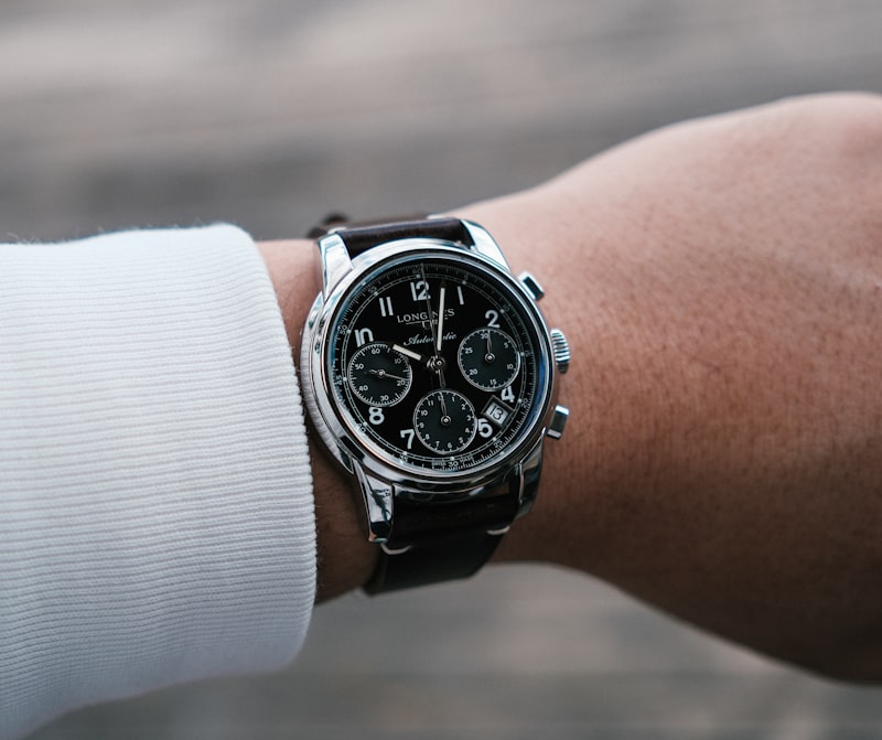 Man wearing a wristwatch with a white shirt