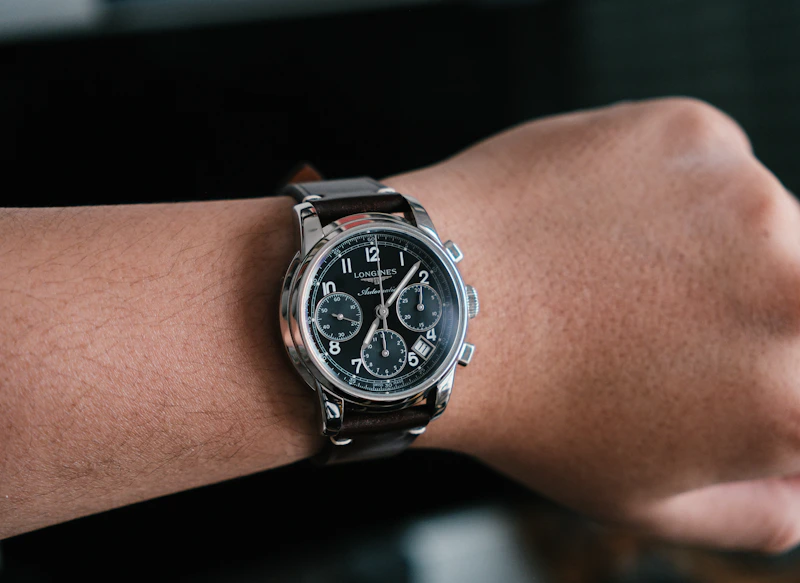 A close-up of an Adelaide Sugar Daddy's wrist, wearing a luxurious chronograph watch.