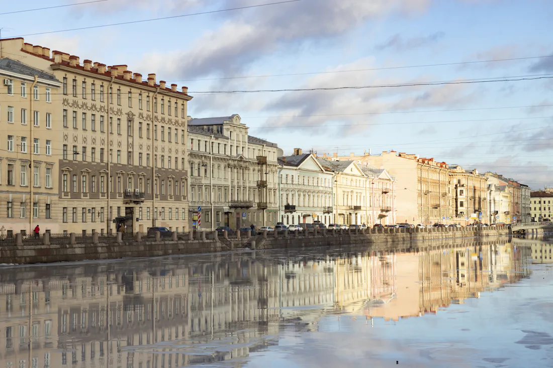 Historic buildings along a frozen canal in Saint Petersburg, Russia