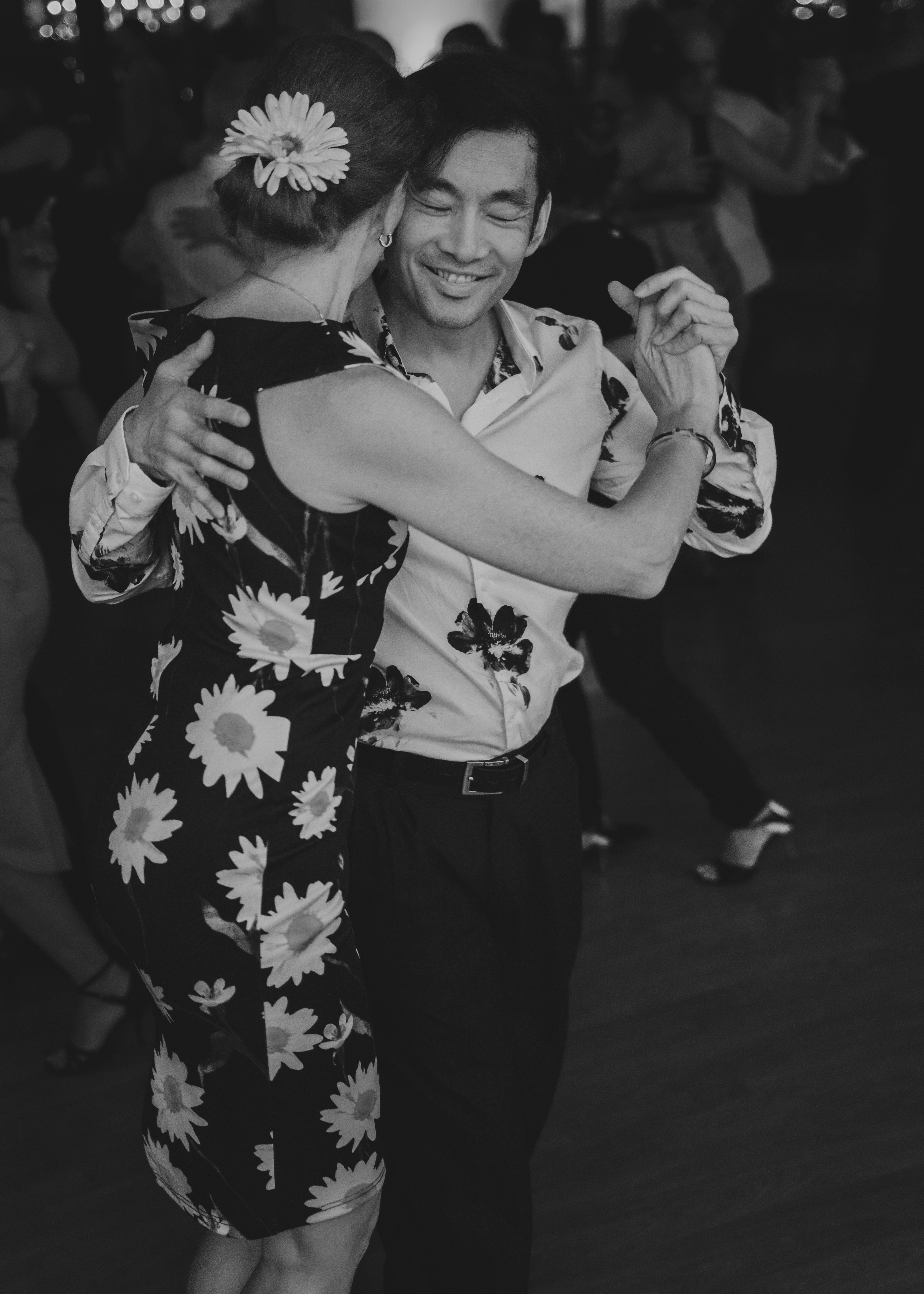 A couple dancing together at a formal event.