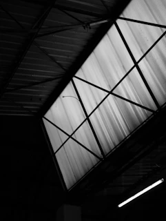 Geometric pattern of a skylight in a dark building