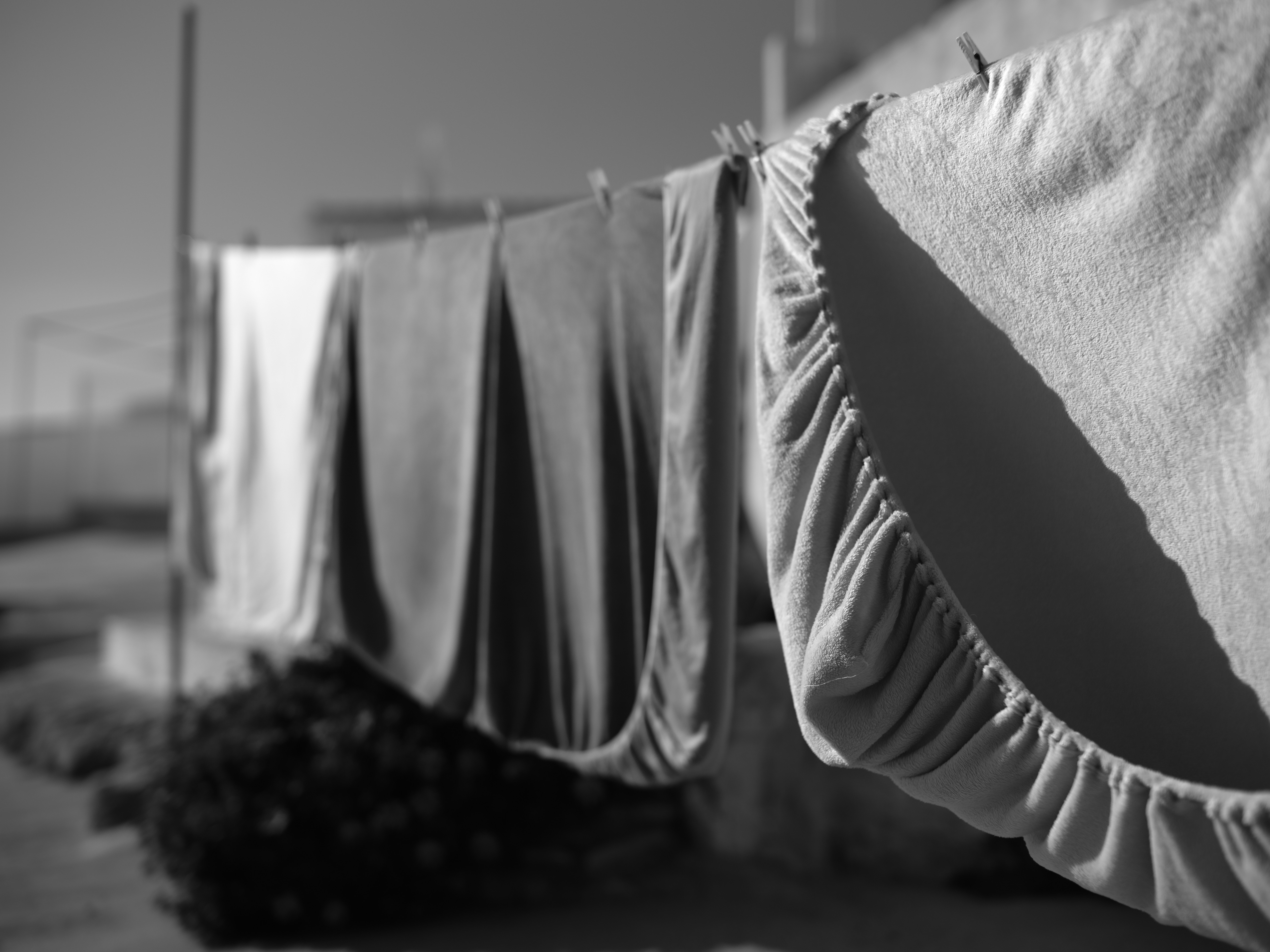 Laundry drying on a clothesline in the sun.