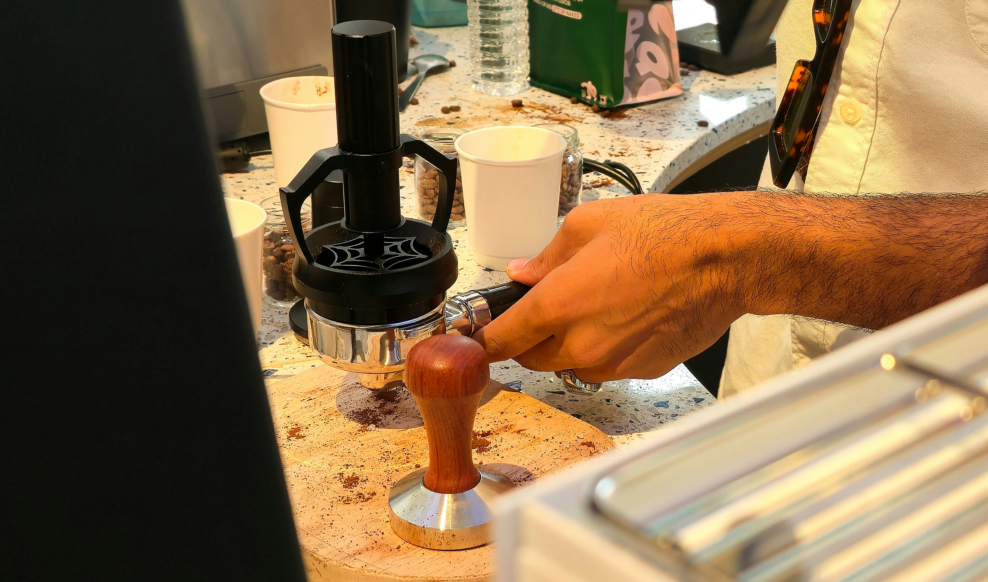 Person using a manual pour-over coffee maker