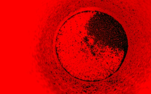 A textured red background with a dark circular shape.