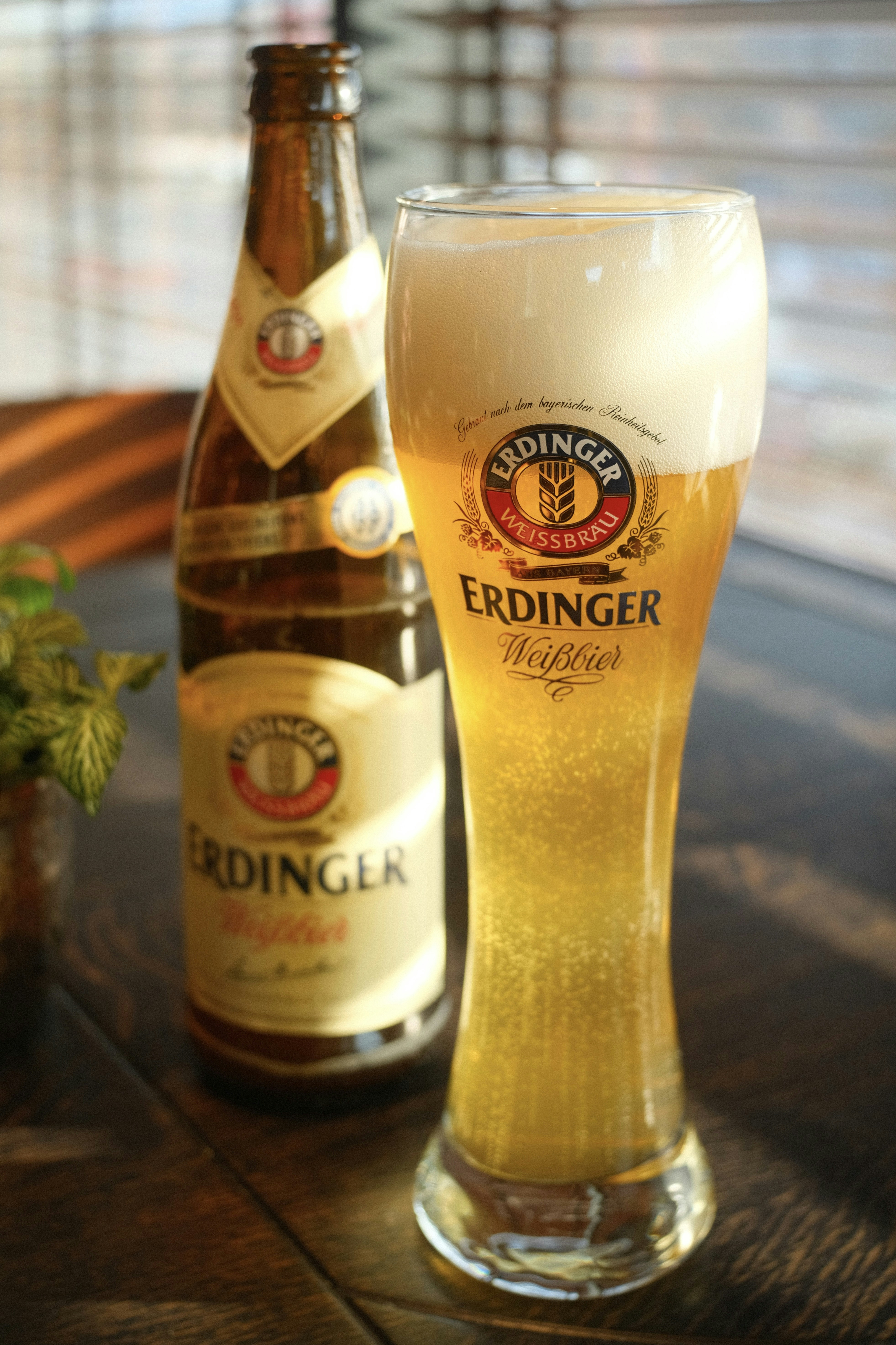 A bottle and glass of erdinger weissbier