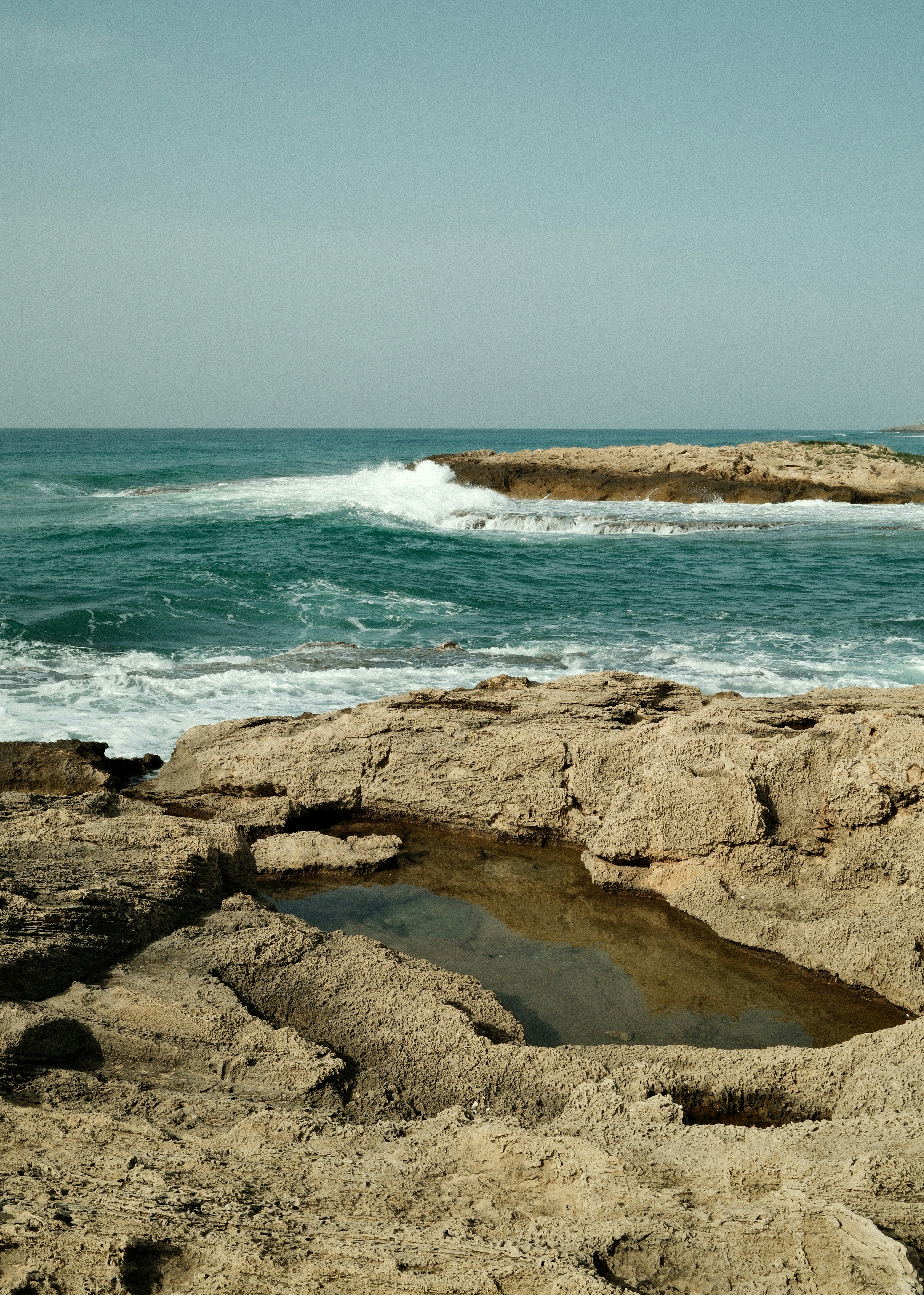 Rocky coastline with waves crashing on shore