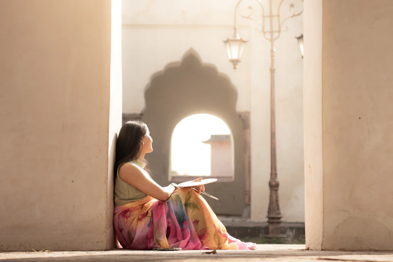 Woman draped in a colourful artisan handwoven saree
