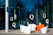 Modern chairs outside a glass building with letter q