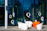 Modern chairs outside a glass building with letter q