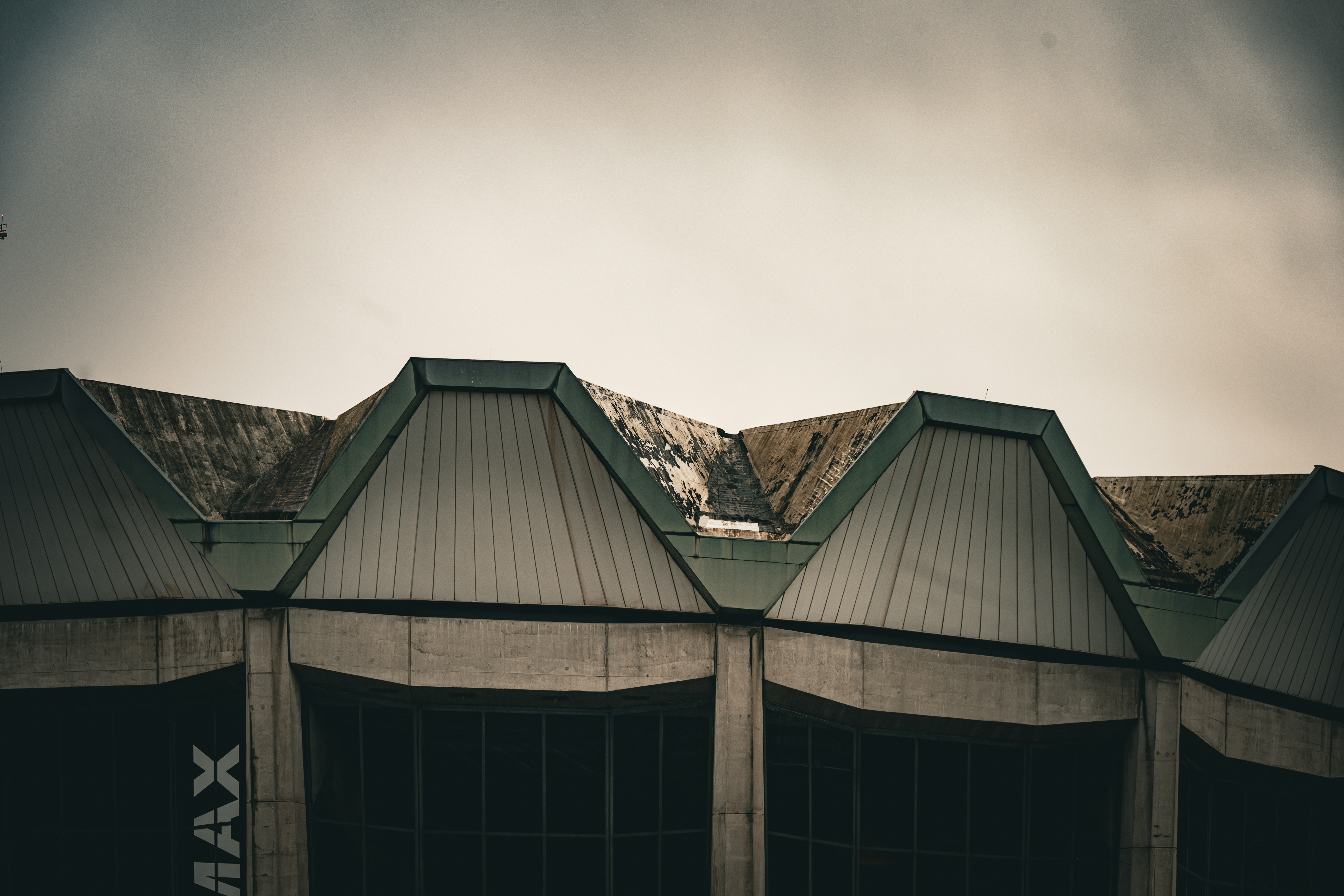 A professional roofing contractor performing a detailed inspection on a commercial flat roof - how a well maintained roof