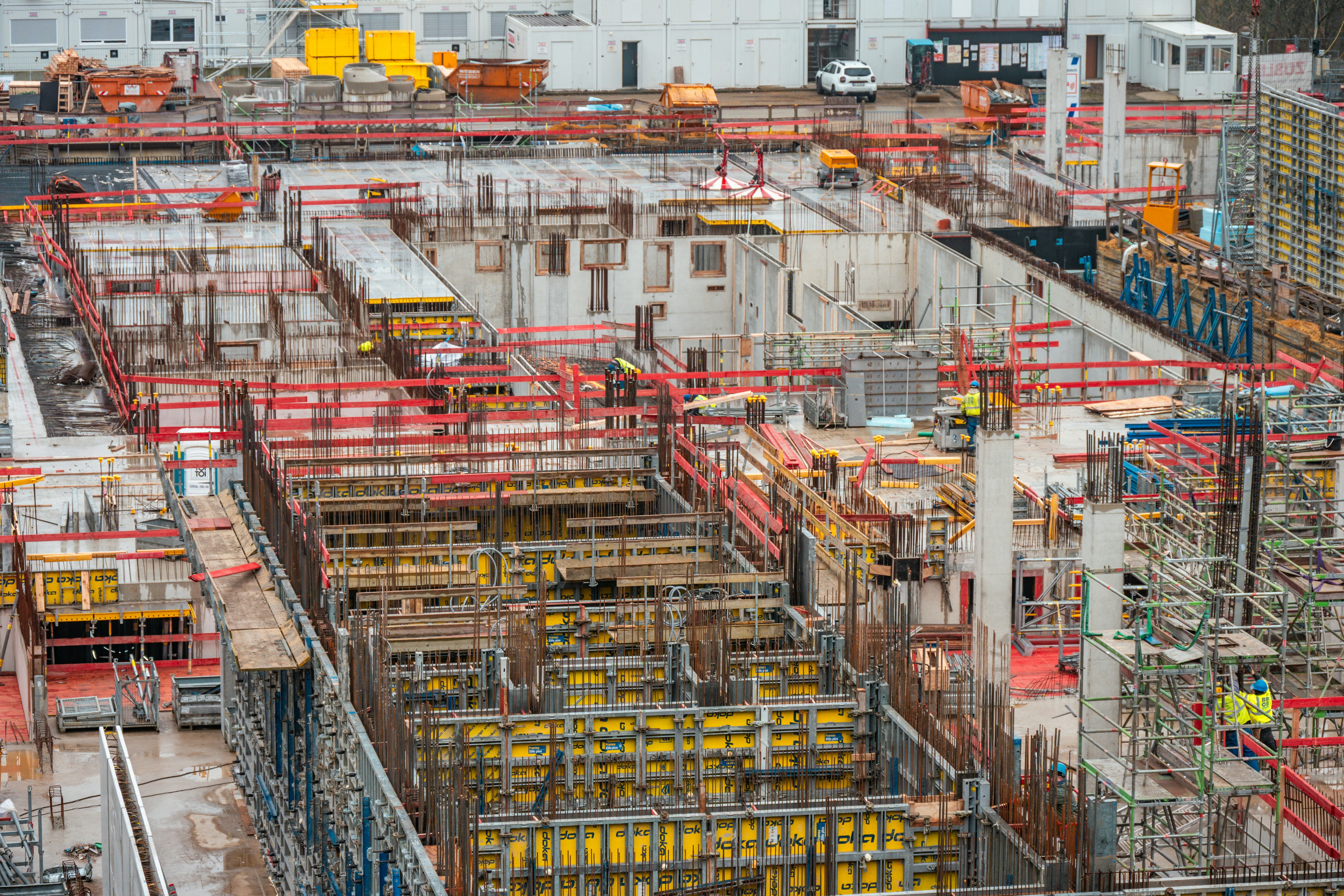 Construction site with complex concrete structures and scaffolding