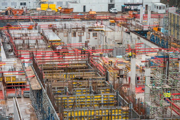 Construction site with complex concrete structures and scaffolding