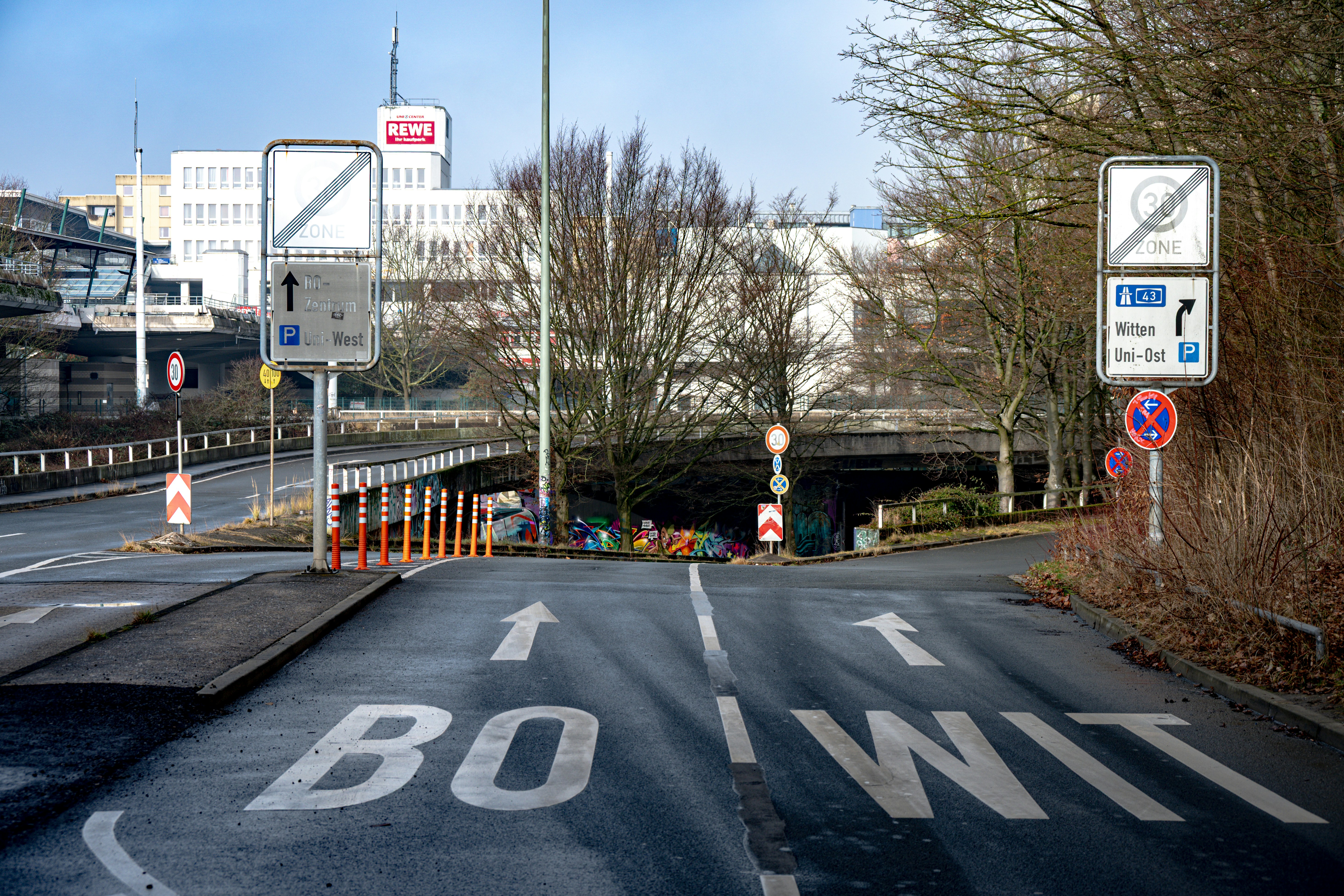 Road with directional arrows and signs