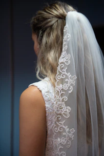 Bride wearing a white veil and dress