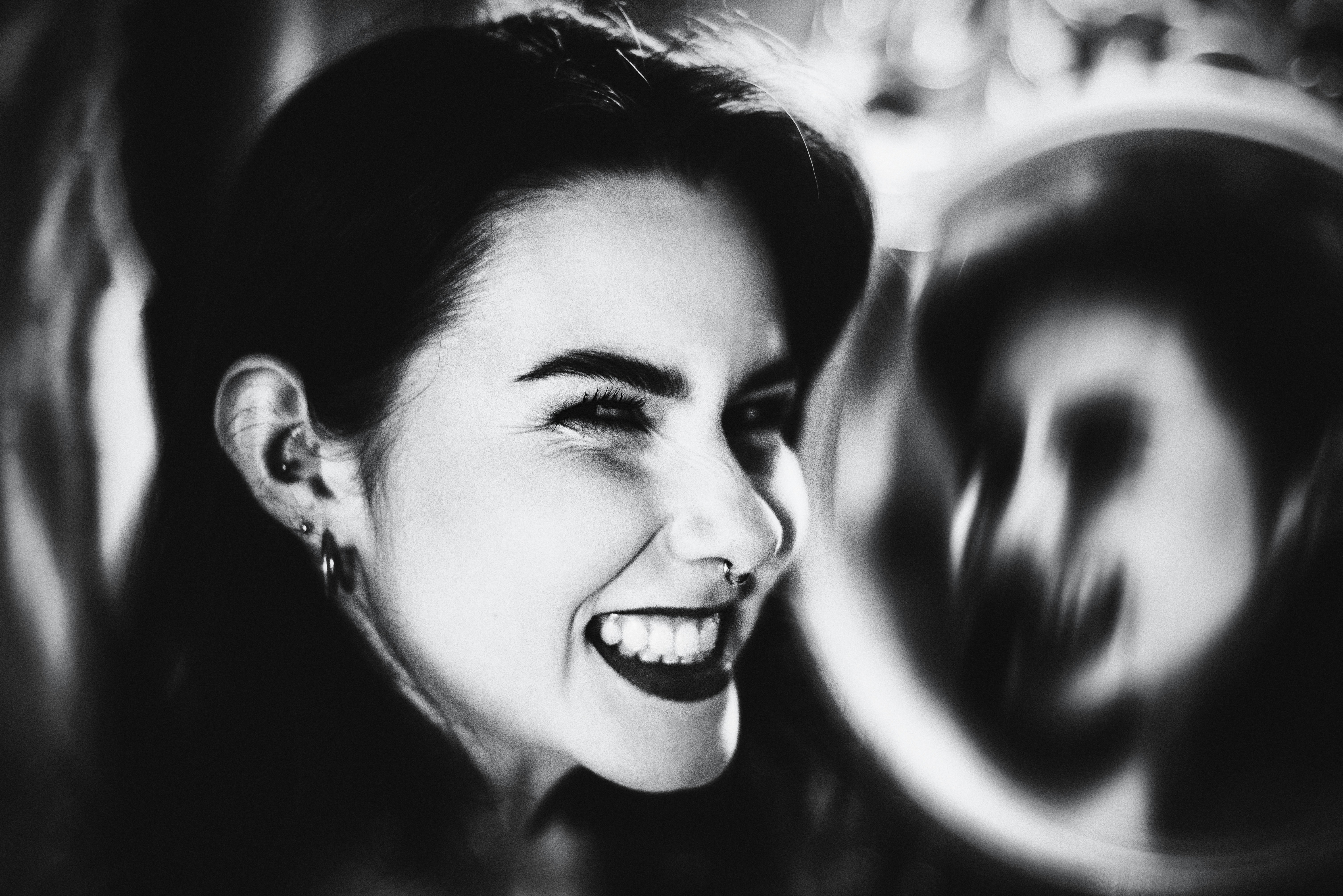 Black and white portrait of a woman smiling