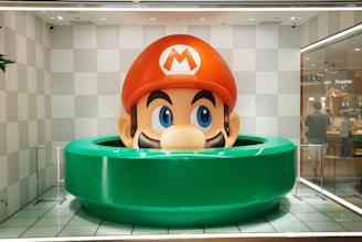 Giant mario head emerging from a green pipe