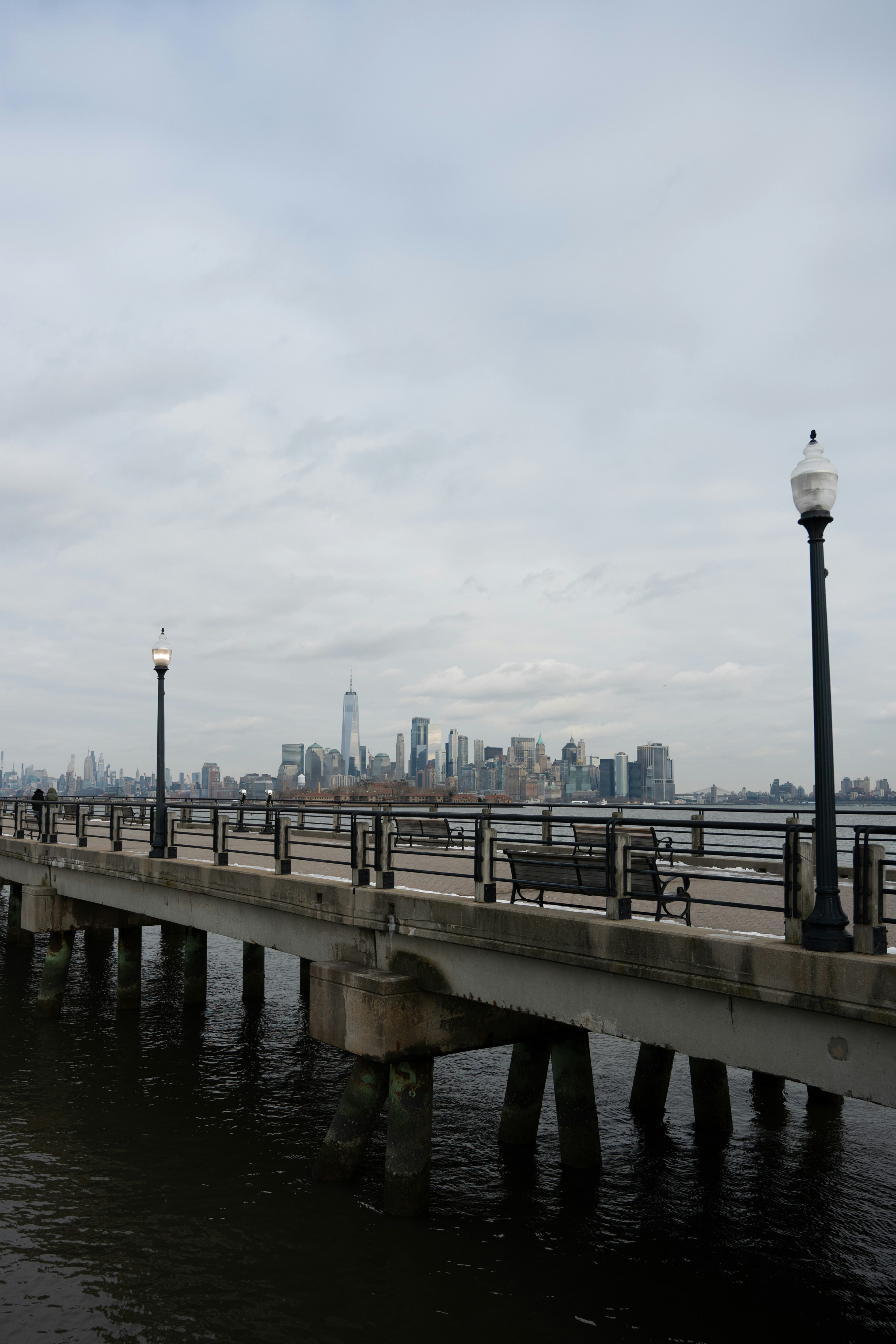 Pier with new york city skyline in the distance