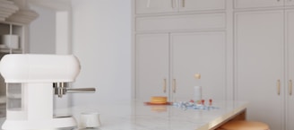White espresso machine on a kitchen counter.