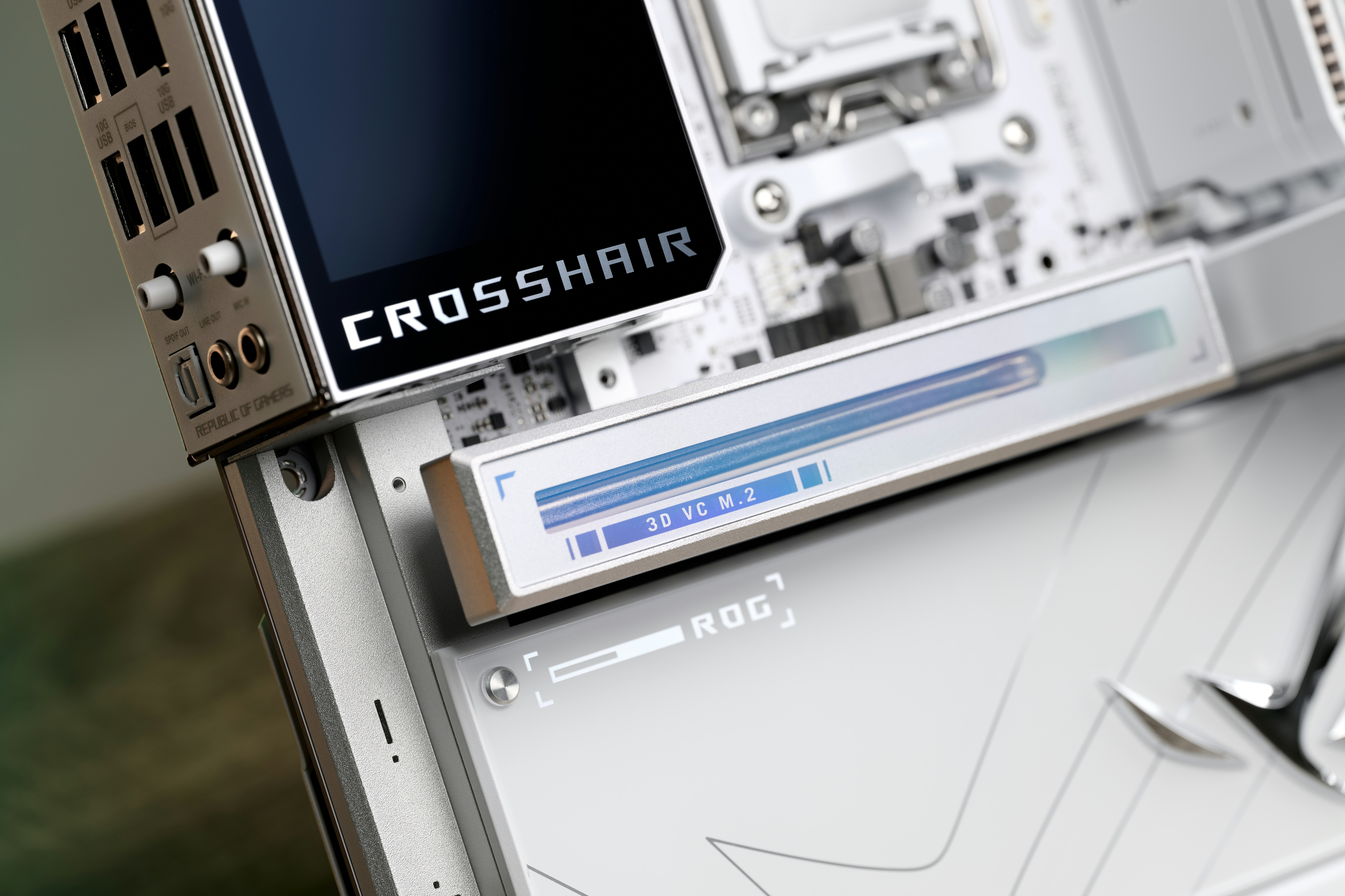 Close-up of a white computer motherboard with "crosshair" text.