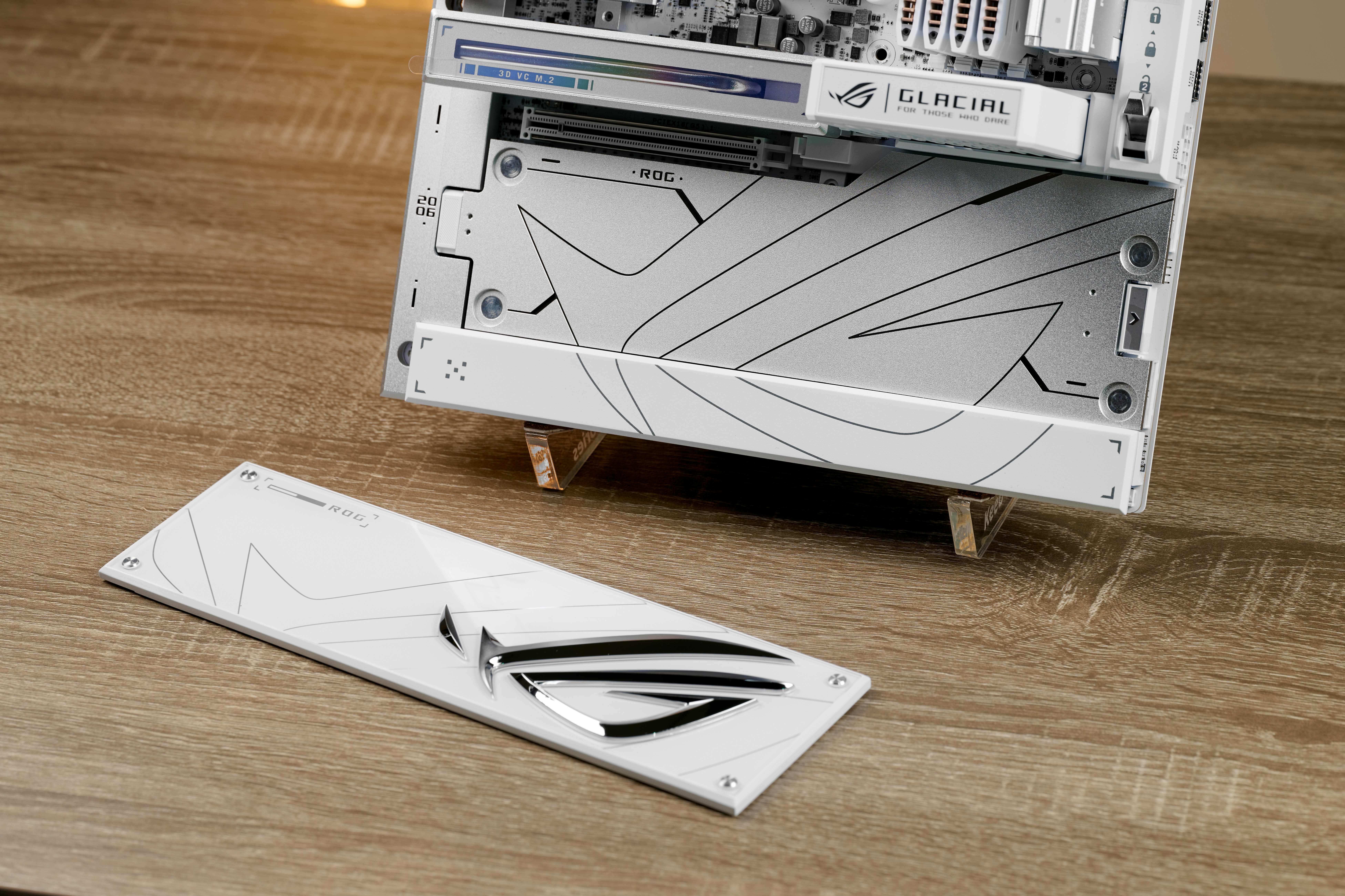 White computer components with geometric patterns on wooden table