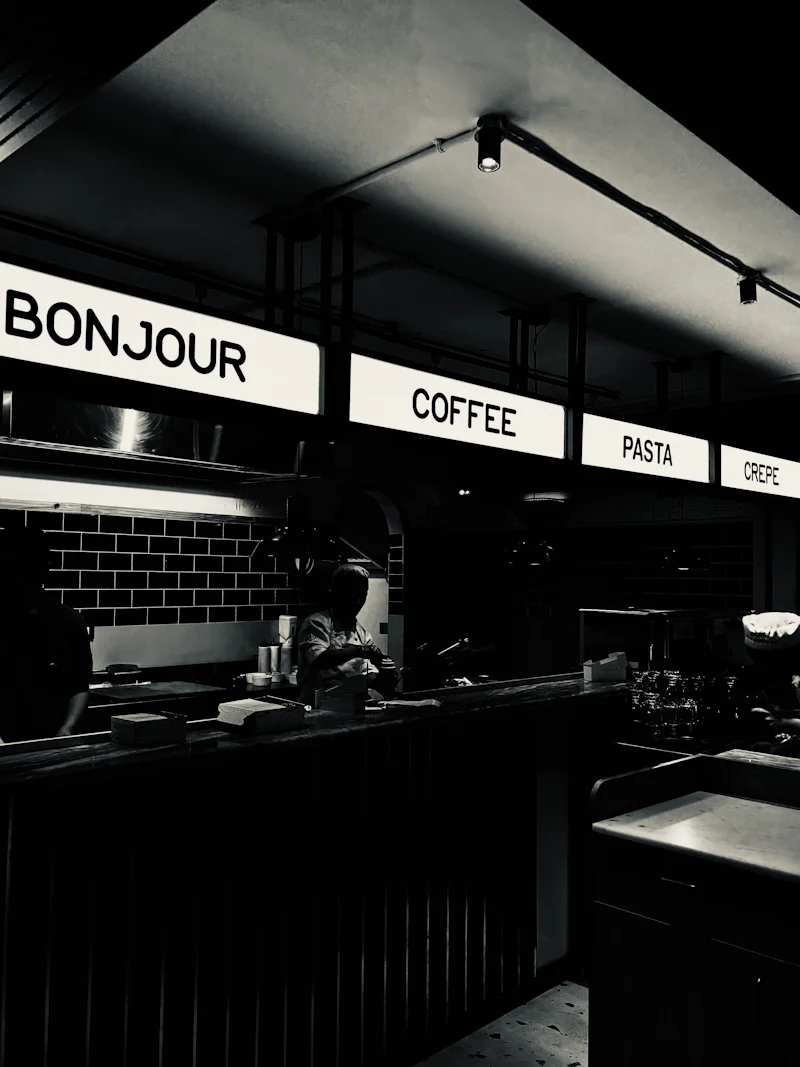 minimalist cafe counter with bold signage and soft lighting capturing modern design and contemporary coffee culture