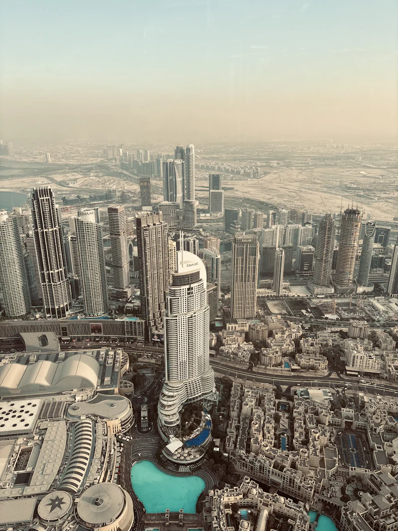 hazy morning over a dense cluster of skyscrapers